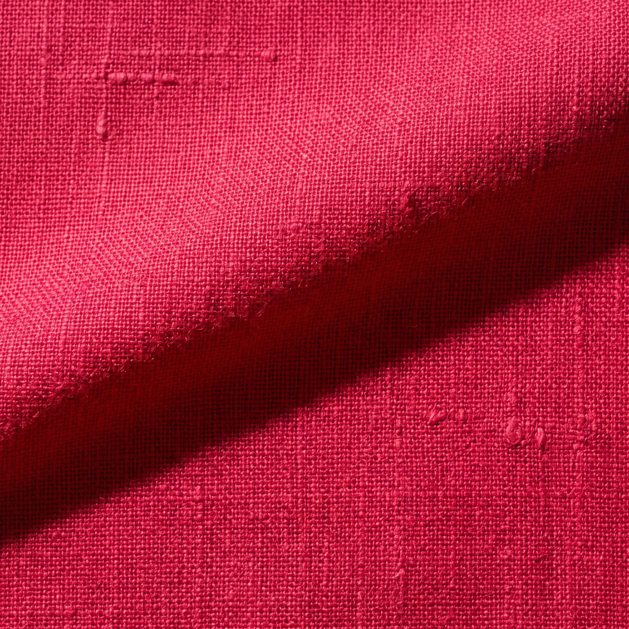 Macro della trama di un tessuto di lino in luce radente